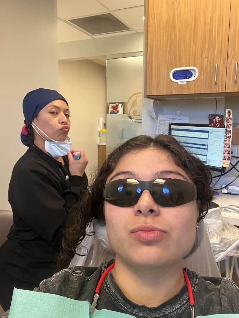 A smiling patient discussing tooth replacement options at Mountain View Smiles