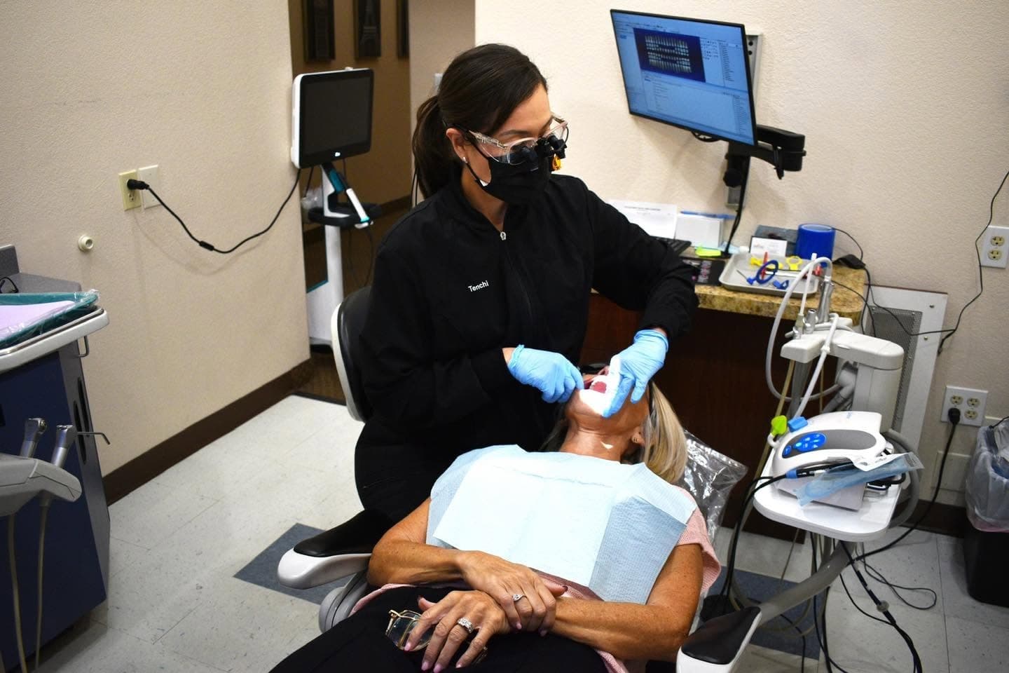 A relaxed patient receiving monitored care at Mountain View Smiles