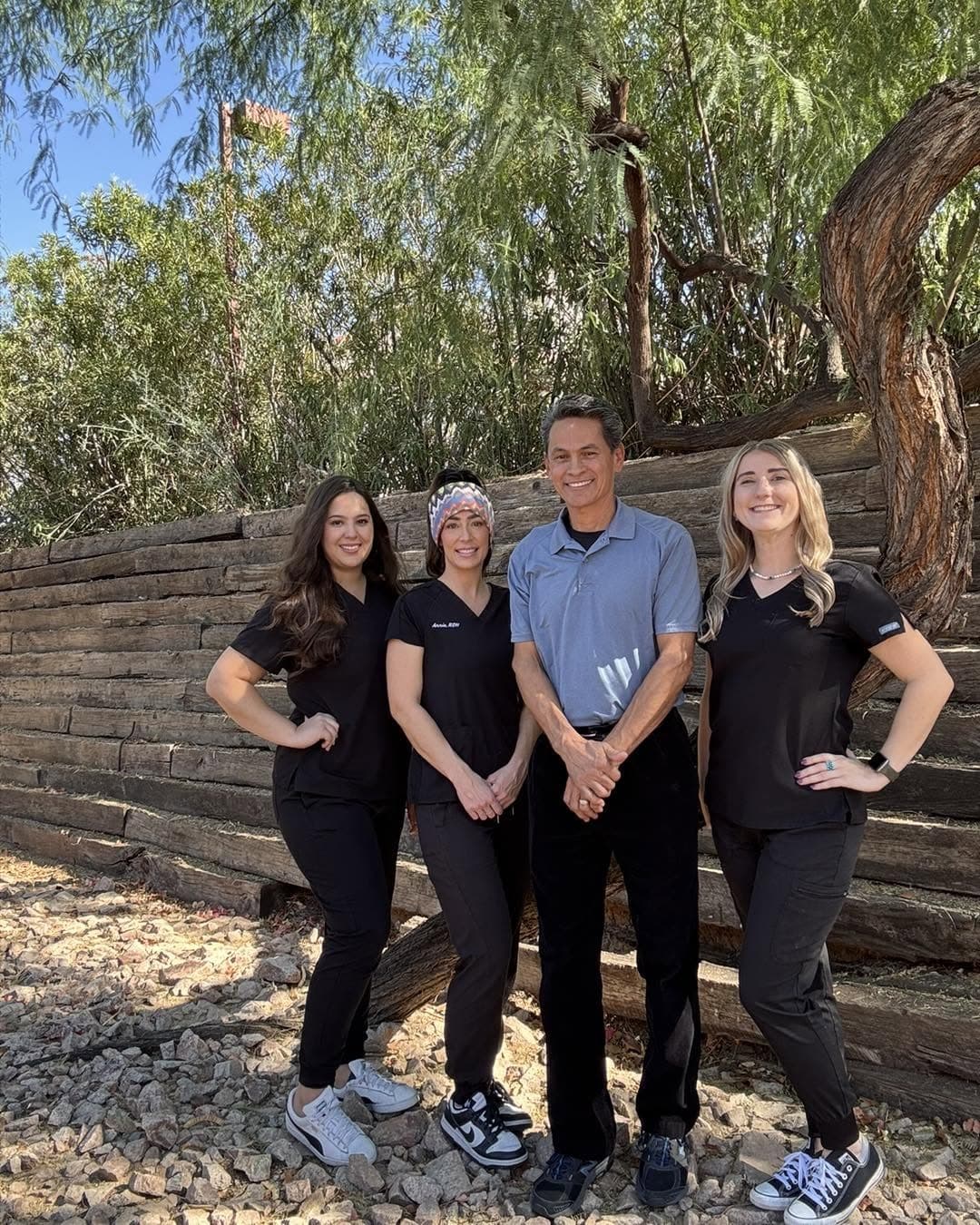 Four members of the Mountain View Smiles team standing together outdoors